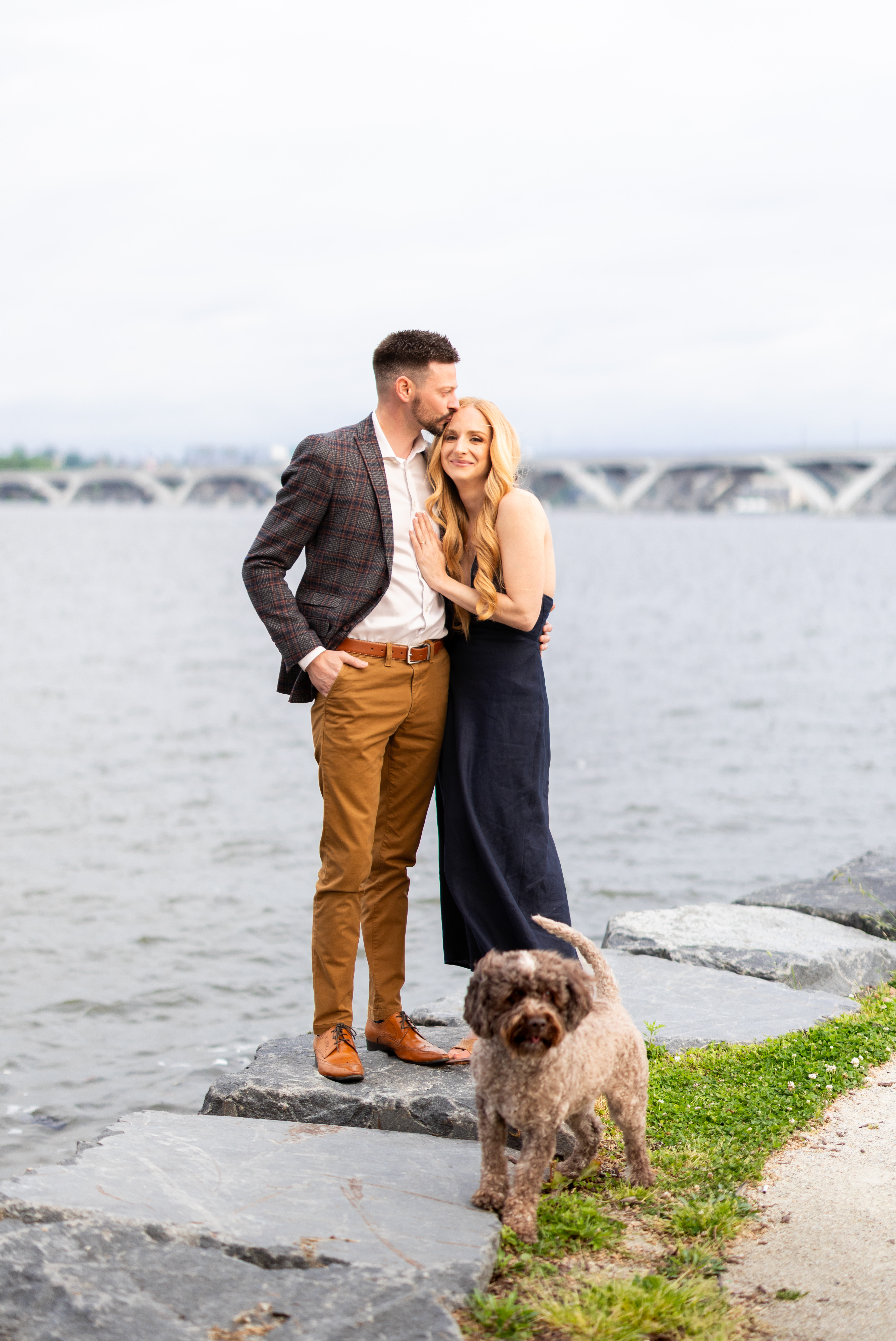 Lauren and Stephen by the water with their dog